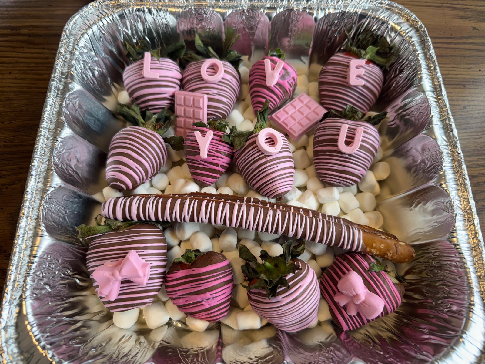 Chocolate-dipped strawberry tray spelling out LOVE YOU